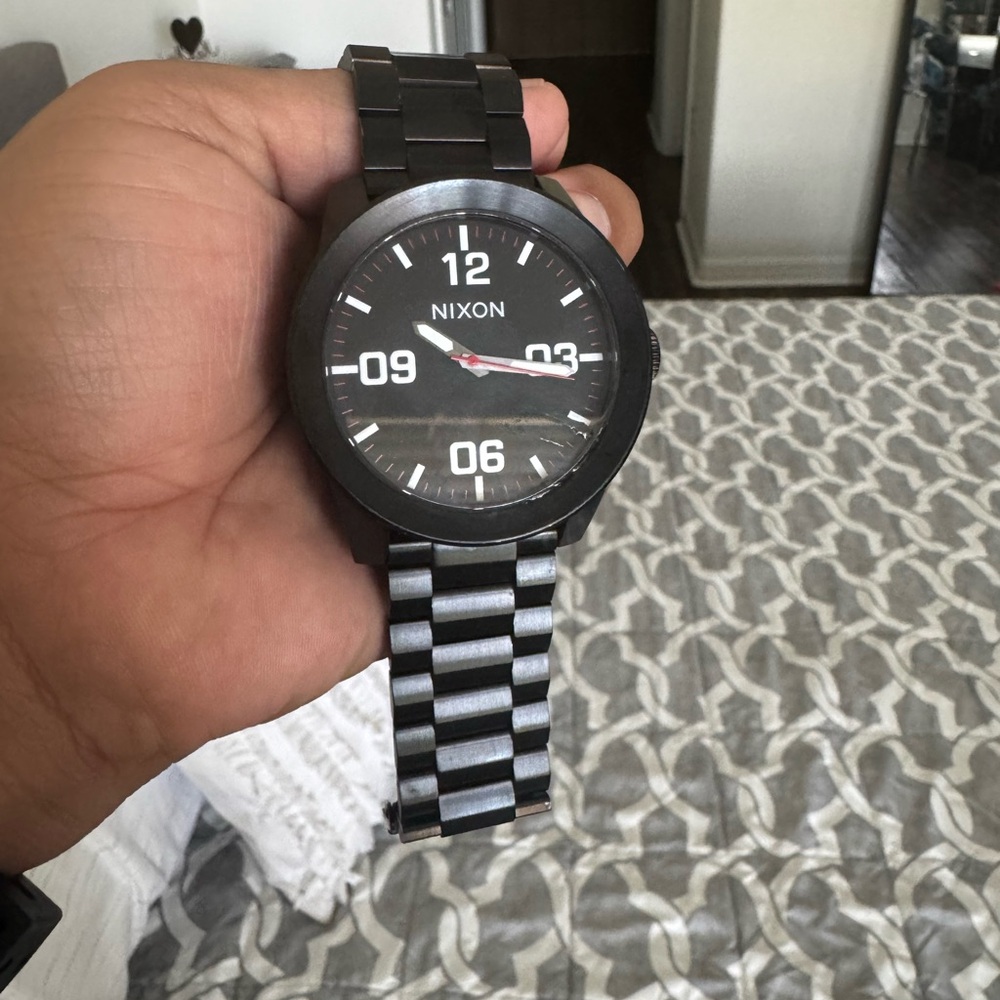Nixon corporal pre own  all black stainless steel. Quartz movement pre own